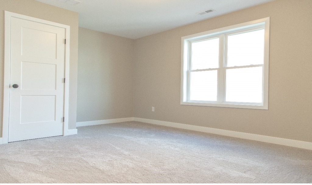 52 Richards Street Worcester, MA 01603 - Photo 9 of 20 an empty room with a window