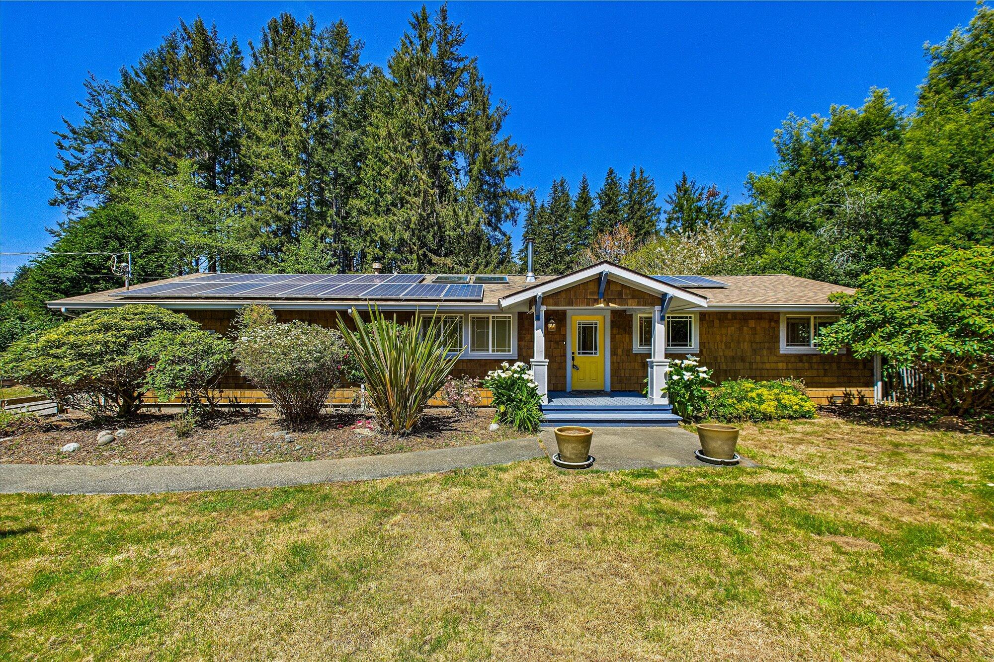 a front view of a house with a yard