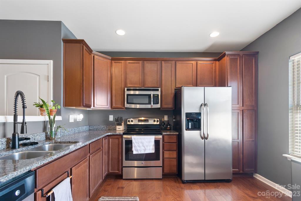 315 Sandy Spring Lane Clover, SC 29710 - Photo 4 of 26 a kitchen with granite countertop stainless steel appliances a refrigerator sink and microwave