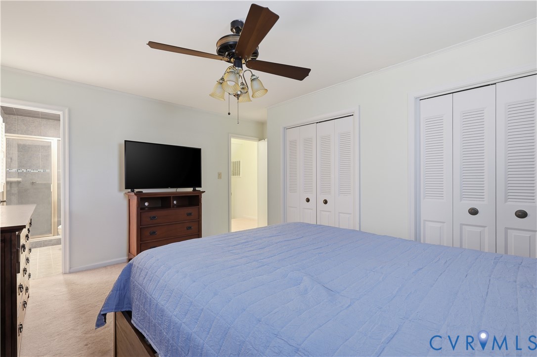1014 Germar Court Colonial Heights, VA 23834 - Photo 21 of 36 a bedroom with a bed and a flat screen tv