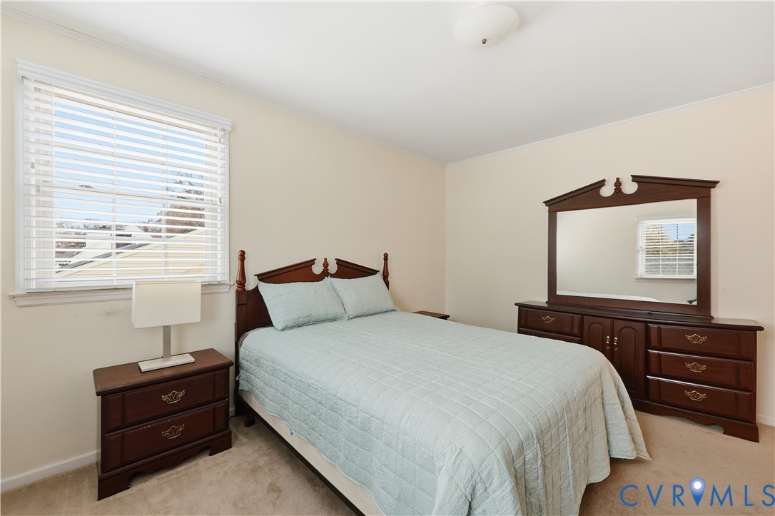 1014 Germar Court Colonial Heights, VA 23834 - Photo 23 of 36 a bedroom with a bed and a dresser