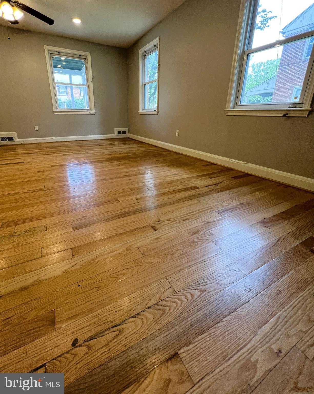 3705 Bancroft Road Baltimore, MD 21215 - Photo 18 of 50 a view of empty room with window and wooden floor