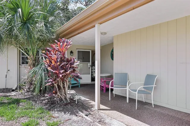 a backyard of a house with seating space