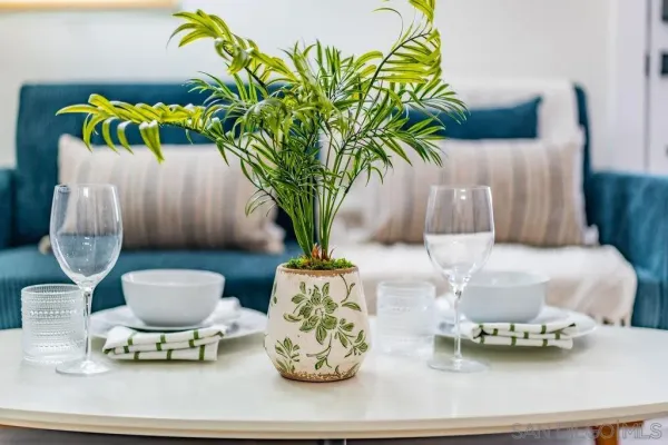 a bedroom with furniture and a mirror