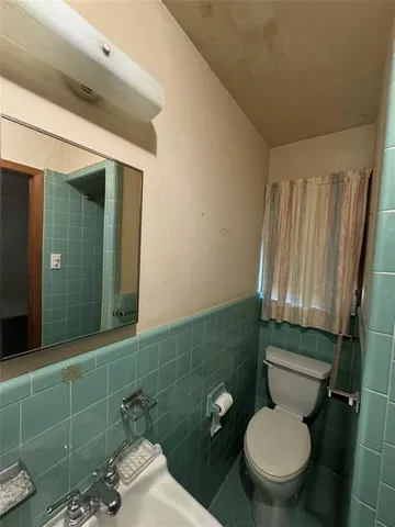 a bathroom with a toilet and a sink