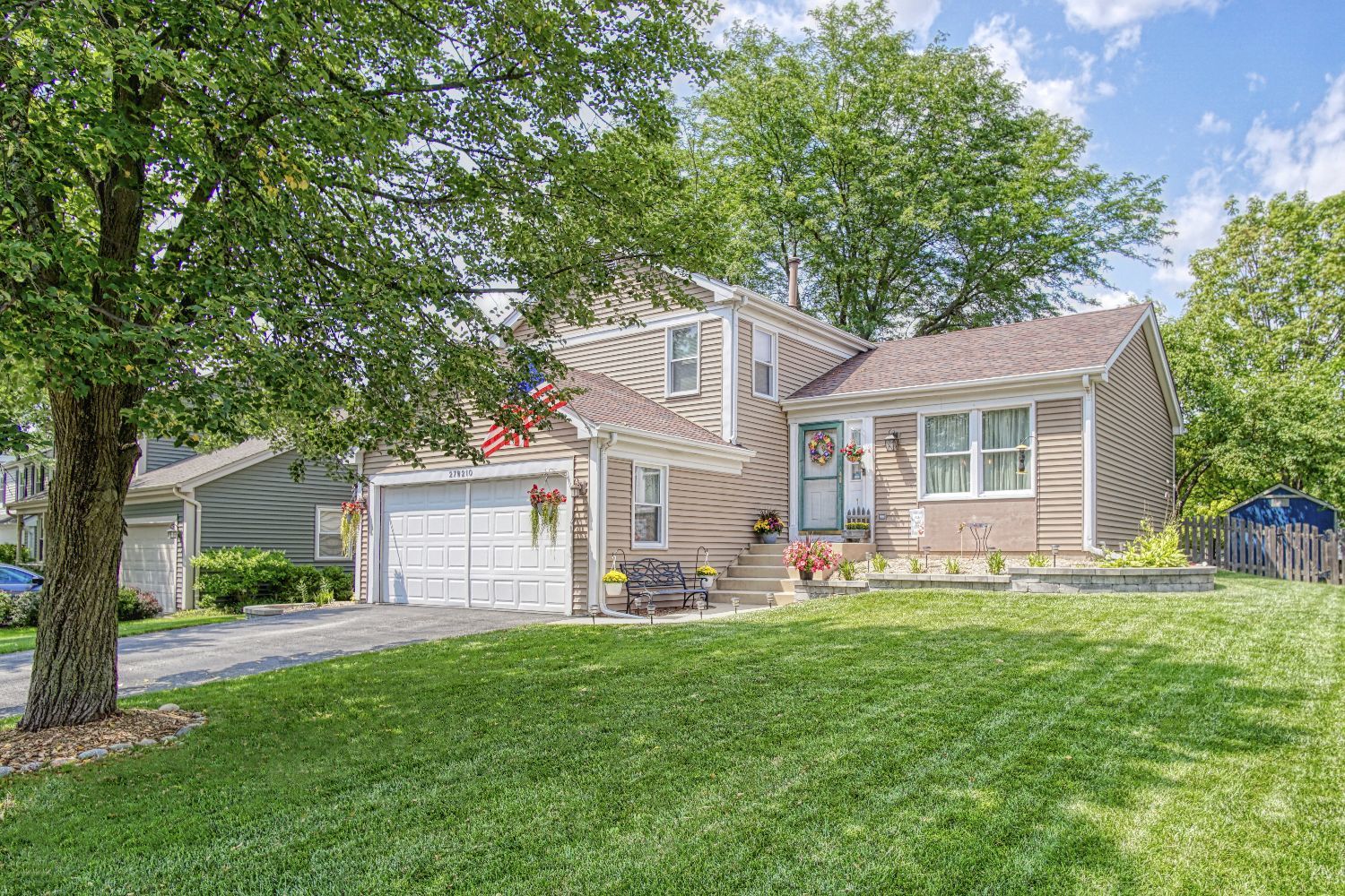a front view of house with yard and outdoor seating