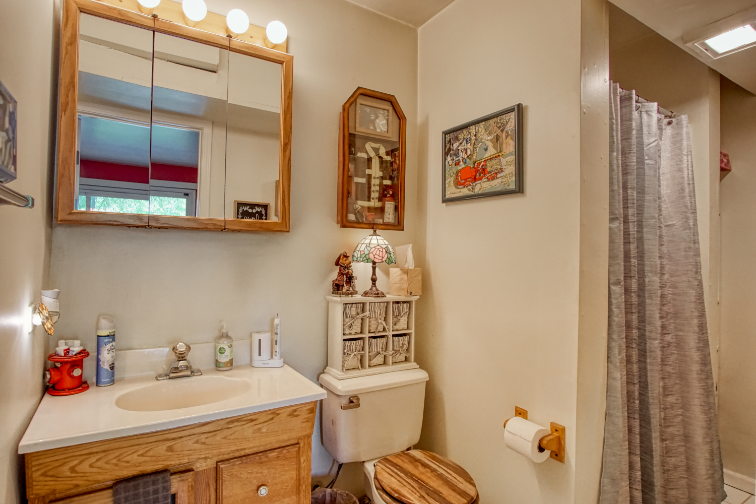 27W210 Churchill Road Winfield, IL 60190 - Photo 12 of 21 a bathroom with a sink mirror and toilet