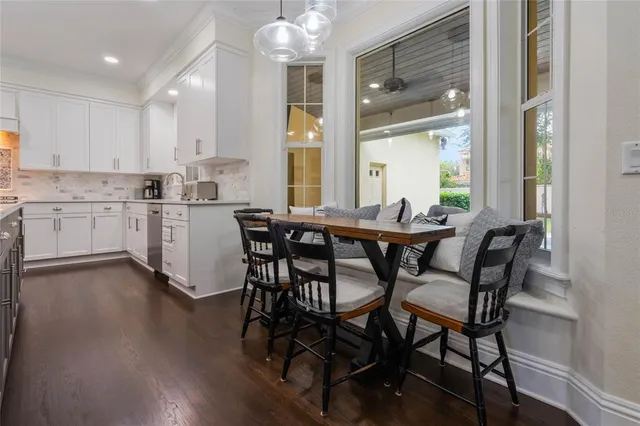 a living room with fireplace furniture and a large window