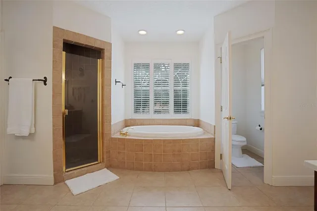 a room with a bed and a night stand