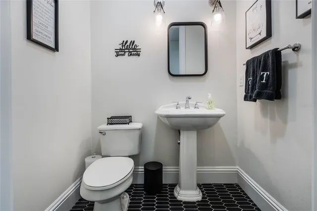 an aerial view of residential houses with outdoor space and street view