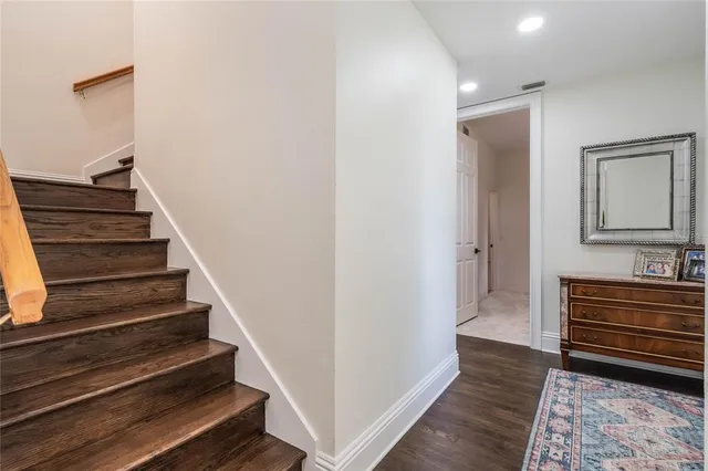 a front view of a house with a yard table and chairs