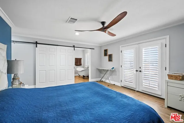 a bathroom with a sink a mirror and a window