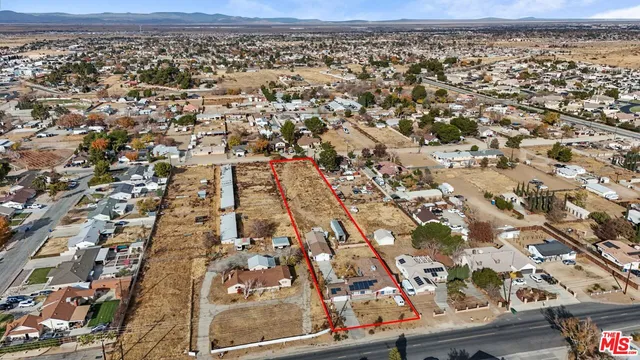 an aerial view of residential house and green space
