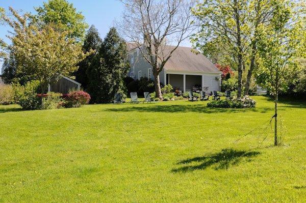 4084 Main Street Barnstable, MA 02675 - Photo 13 of 15 a front view of house with yard and green space