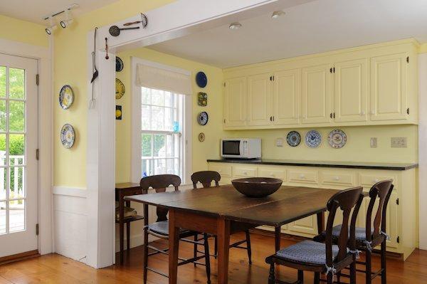 4084 Main Street Barnstable, MA 02675 - Photo 5 of 15 a kitchen with a table and chairs in it