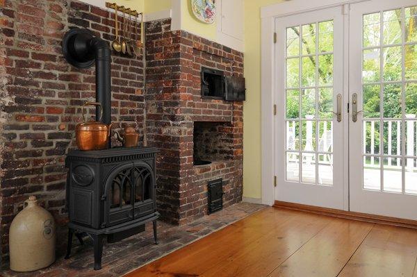4084 Main Street Barnstable, MA 02675 - Photo 7 of 15 a view of fireplace with washer and dryer