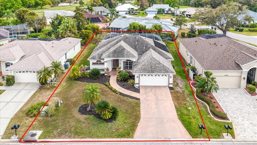 6710 Pleasant Hill Road Bradenton, FL 34203 - Photo 11 of 72 an aerial view of a house with swimming pool and ocean view