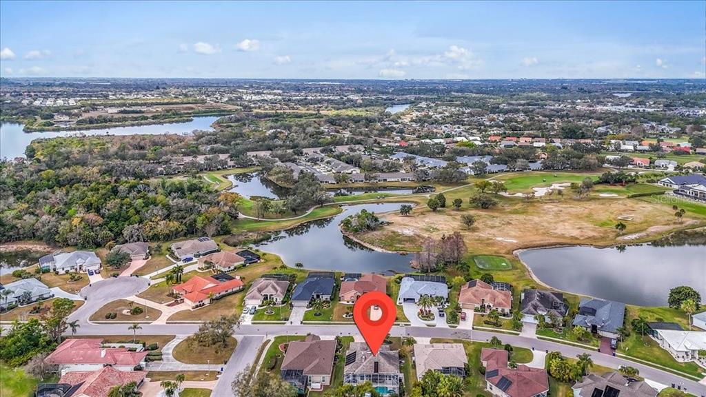 6710 Pleasant Hill Road Bradenton, FL 34203 - Photo 12 of 72 an aerial view of residential houses with outdoor space