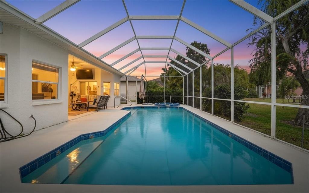 6710 Pleasant Hill Road Bradenton, FL 34203 - Photo 15 of 72 a view of a swimming pool with a porch