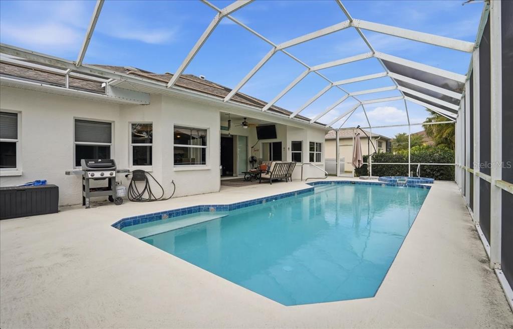 6710 Pleasant Hill Road Bradenton, FL 34203 - Photo 19 of 72 a view of a swimming pool with outdoor seating