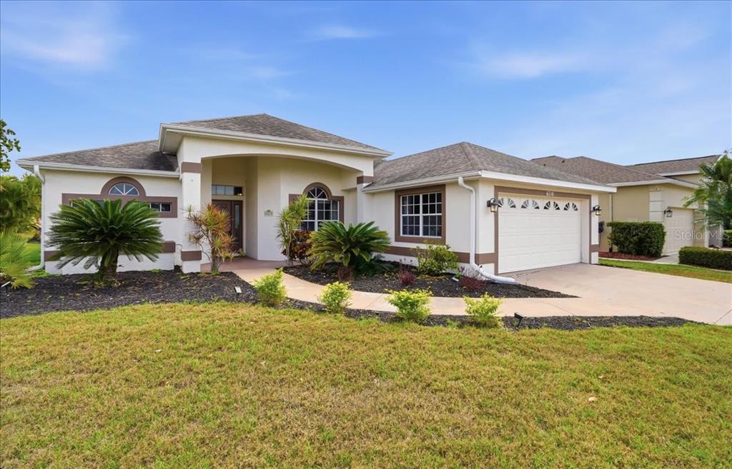 6710 Pleasant Hill Road Bradenton, FL 34203 - Photo 2 of 72 a front view of a house with a yard