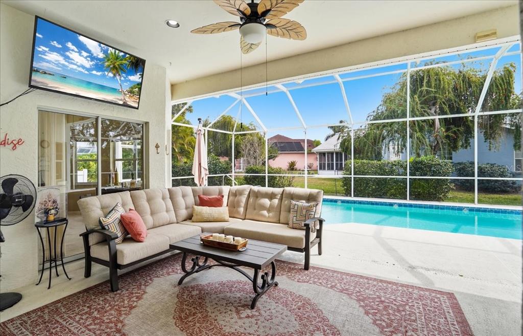 6710 Pleasant Hill Road Bradenton, FL 34203 - Photo 24 of 72 a living room with furniture tv and a large window