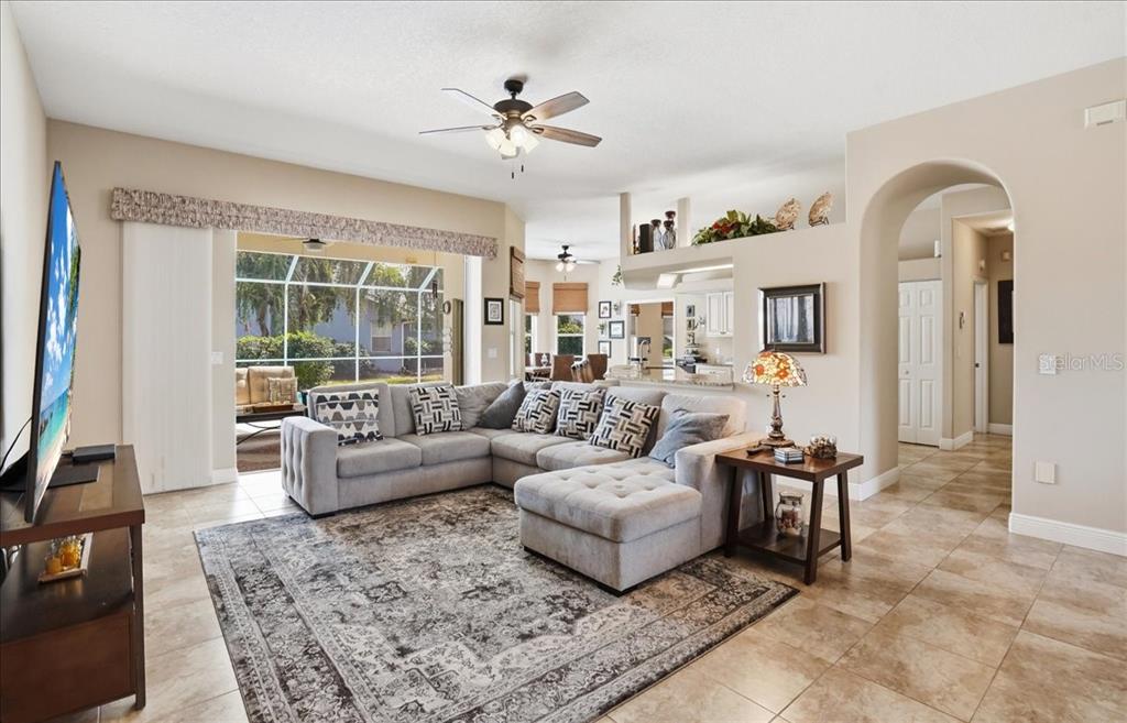 6710 Pleasant Hill Road Bradenton, FL 34203 - Photo 26 of 72 a living room with furniture and a large window