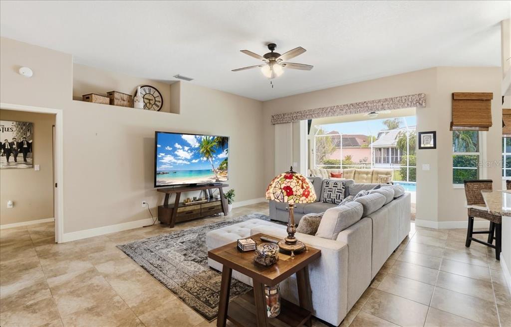 6710 Pleasant Hill Road Bradenton, FL 34203 - Photo 27 of 72 a living room with furniture and a flat screen tv