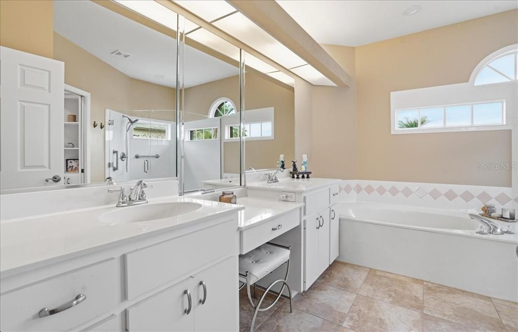 6710 Pleasant Hill Road Bradenton, FL 34203 - Photo 42 of 72 a spacious bathroom with a double vanity sink mirror and double