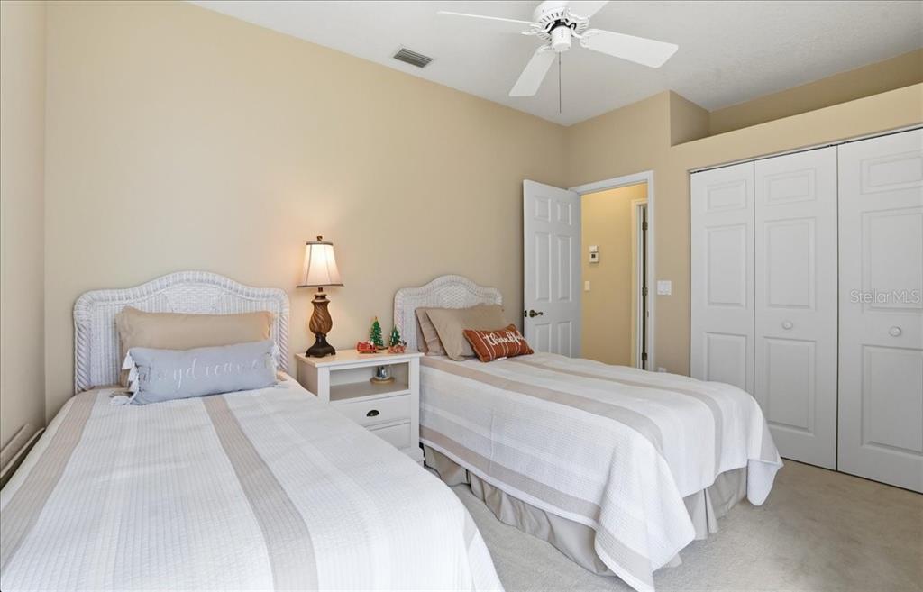 6710 Pleasant Hill Road Bradenton, FL 34203 - Photo 44 of 72 a bedroom with a bed and a chandelier