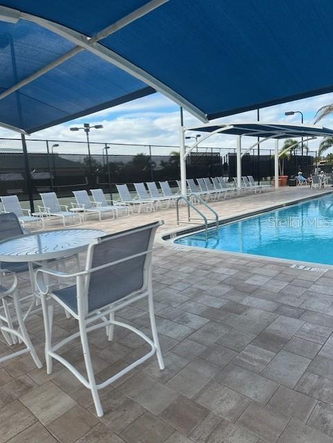 6710 Pleasant Hill Road Bradenton, FL 34203 - Photo 65 of 72 a dinning table and chairs in the patio