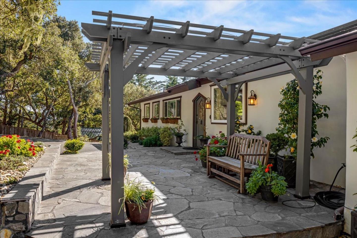 15 Mentone Road Carmel, CA 93923 - Photo 4 of 47 a view of a porch with furniture and garden