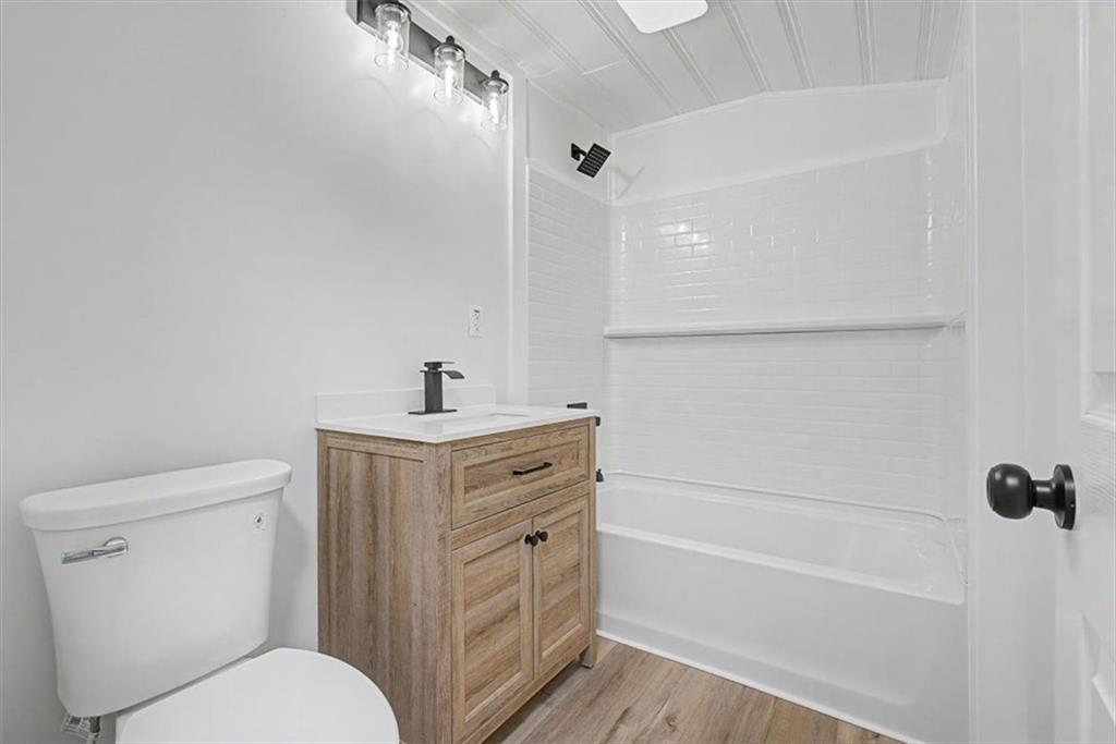 2115 King Road Dalton, GA 30720 - Photo 29 of 54 a bathroom with a toilet a sink and a bathtub