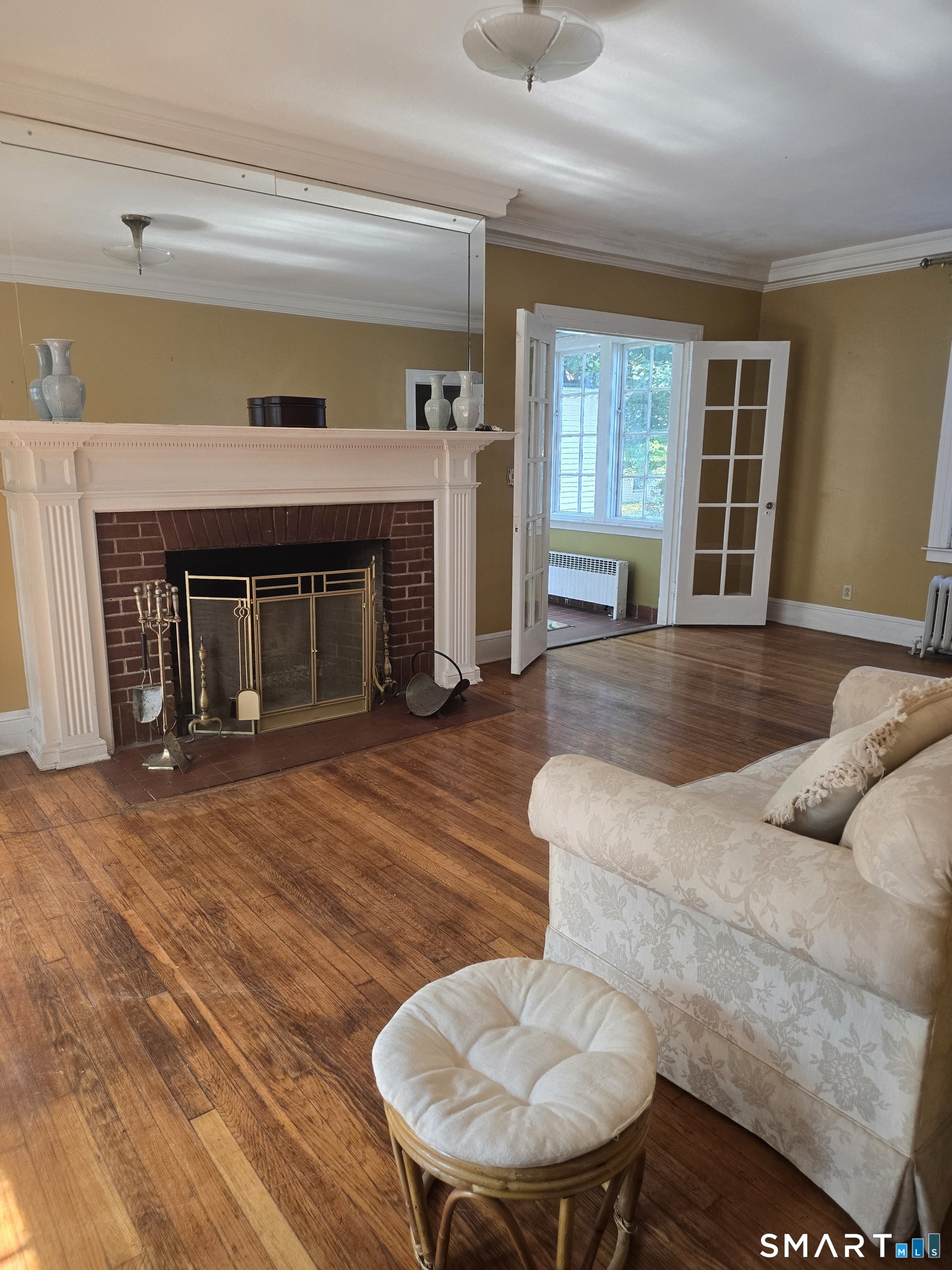 197 Ridgefield Street Hartford, CT 06112 - Photo 10 of 26 Spacious living room with fireplace