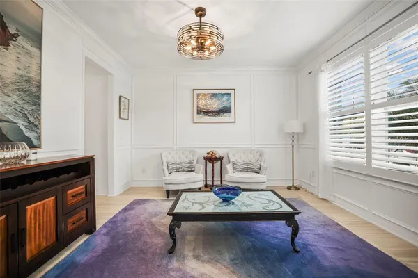a bedroom with a bed a dresser and a window
