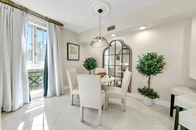 a view of a livingroom with furniture and a potted plant