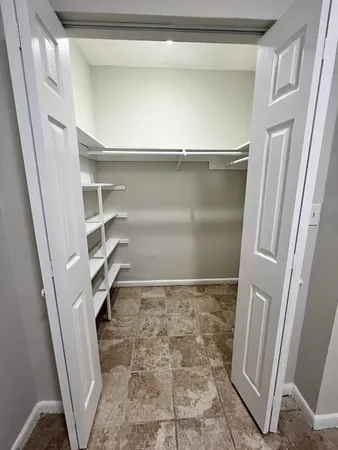 a view of an empty walk in closet