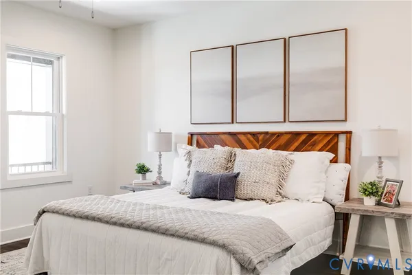 a bedroom with a bed and window