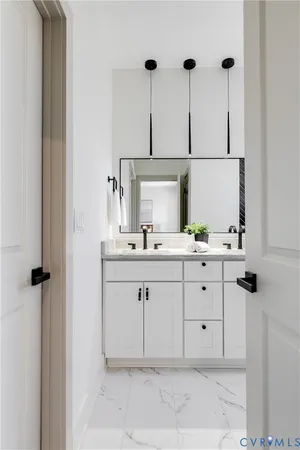 a bathroom with a sink and a mirror