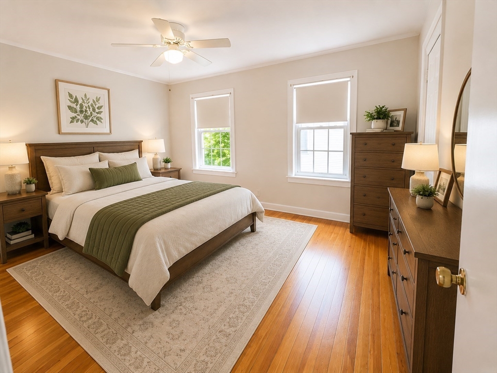 36 Plummer Avenue Lowell, MA 01852 - Photo 15 of 23 a spacious bedroom with a bed and wooden floor