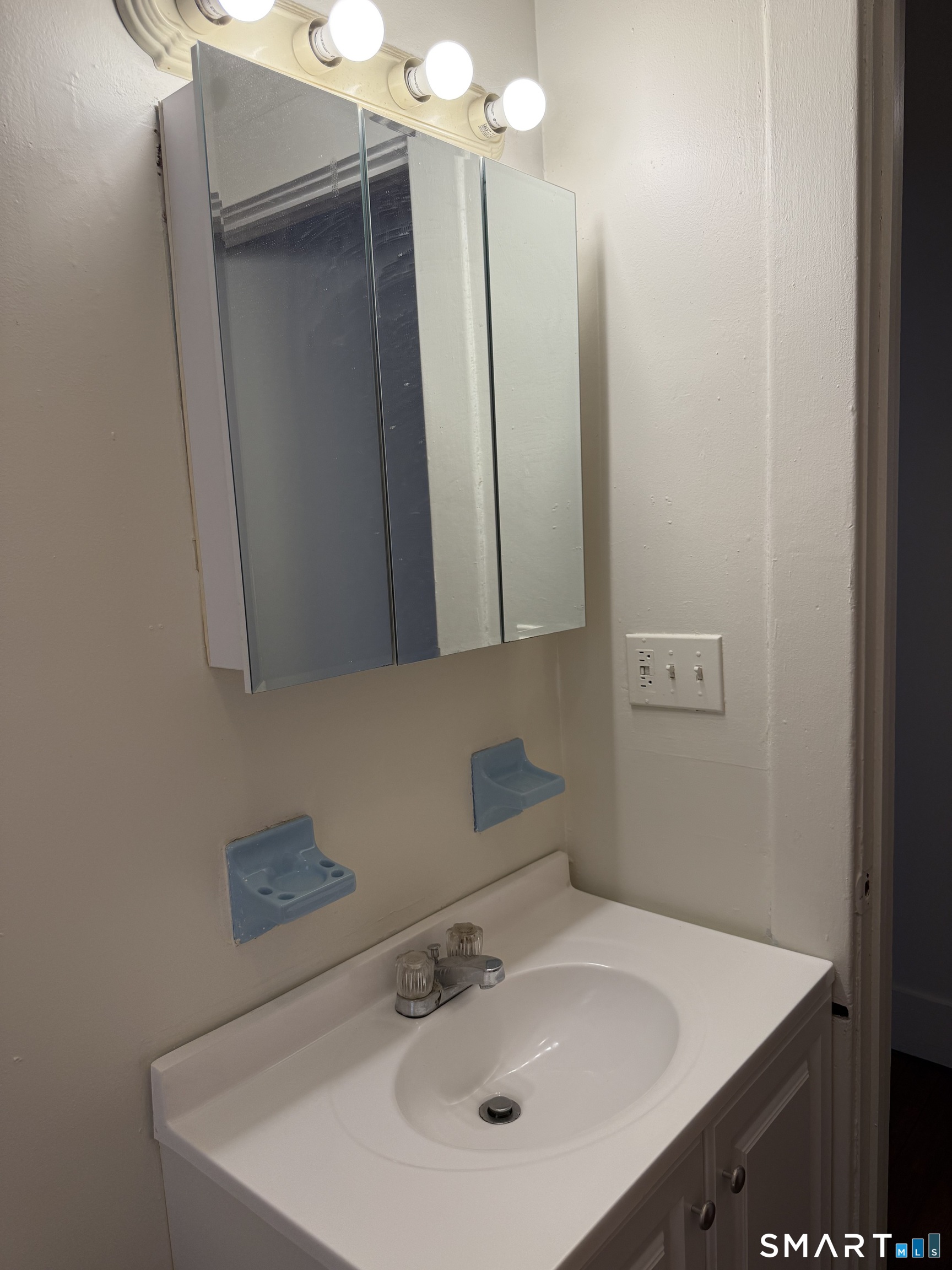 38 Read Street New Haven, CT 06511 - Photo 7 of 10 a bathroom with a sink and a mirror
