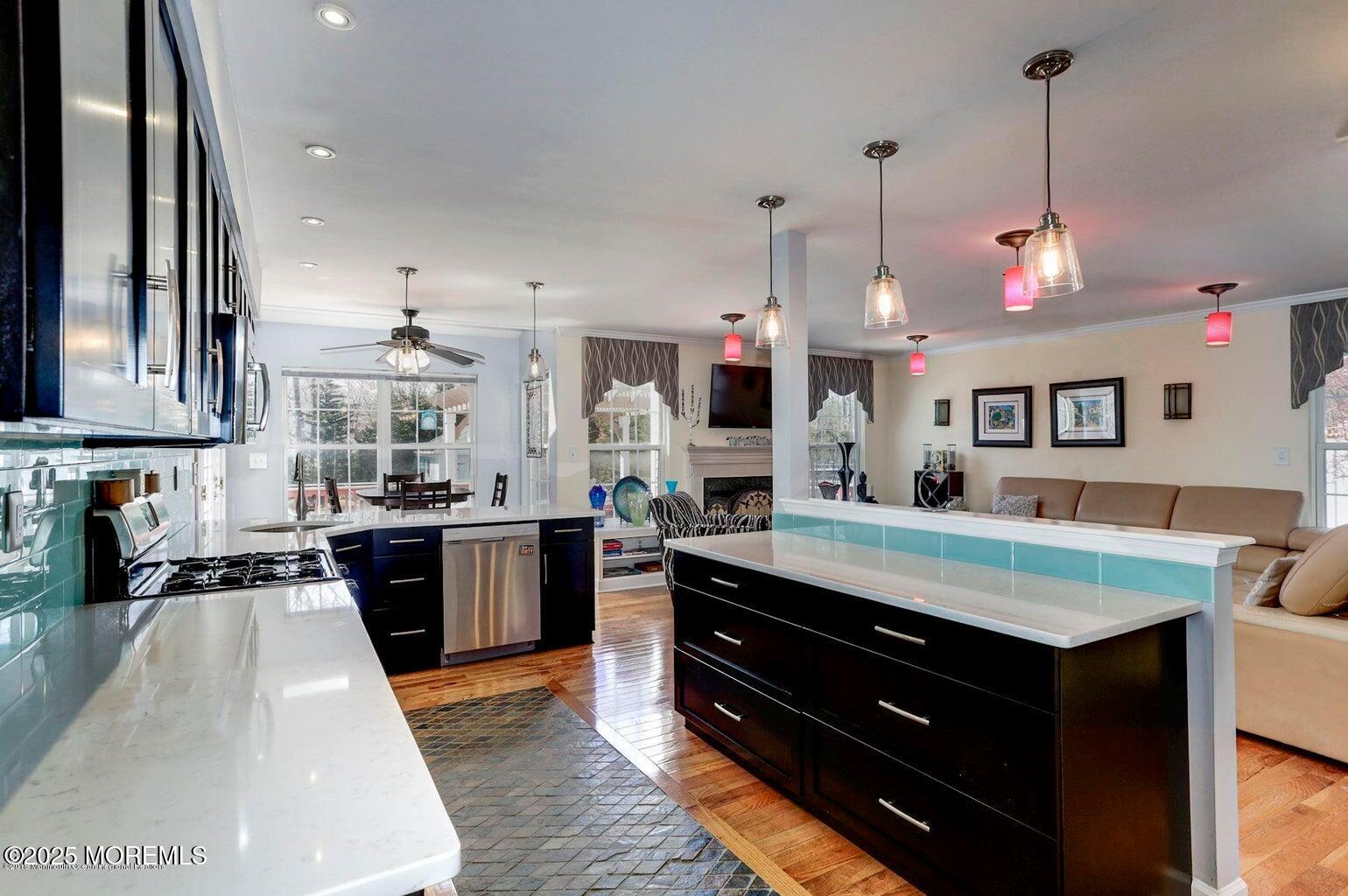 6 Diamond Lane Howell, NJ 07731 - Photo 3 of 78 a kitchen with stainless steel appliances granite countertop a stove a sink and a refrigerator