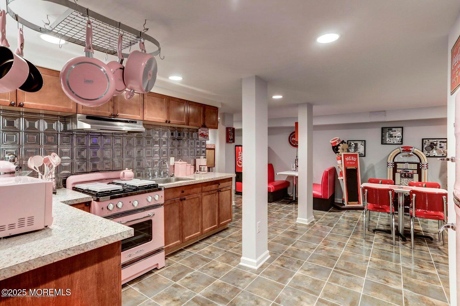 6 Diamond Lane Howell, NJ 07731 - Photo 35 of 78 a kitchen with stainless steel appliances granite countertop a stove and cabinets