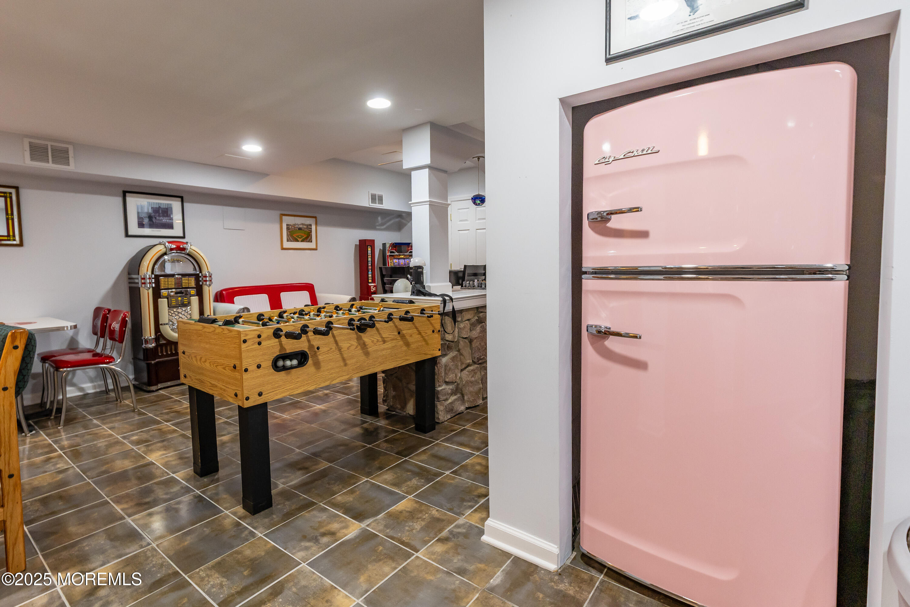 6 Diamond Lane Howell, NJ 07731 - Photo 45 of 78 a view of a room that has a table and chairs in it