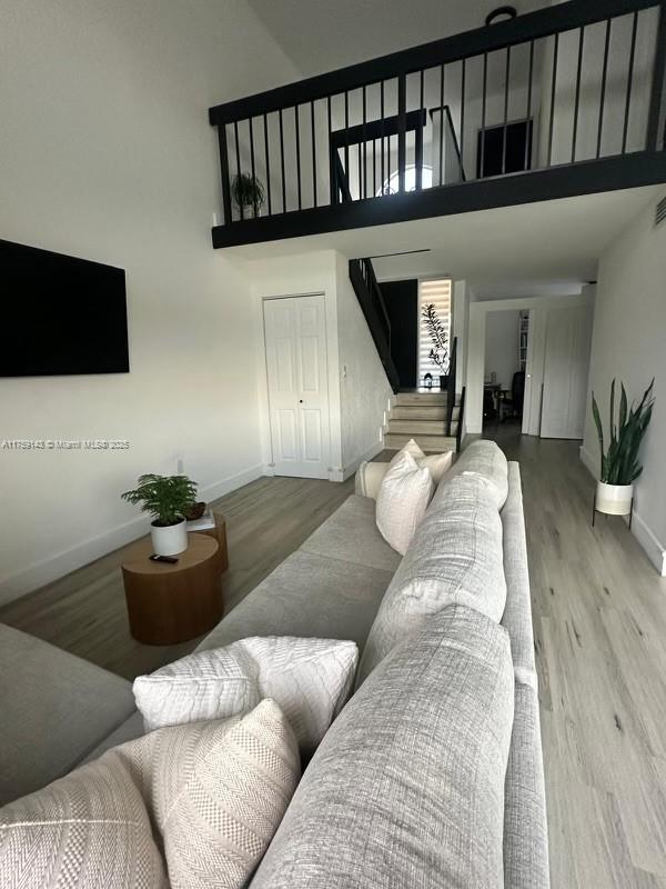 1351 Southwest 124th Court, Unit B5 Miami, FL 33184 - Photo 17 of 37 a living room with furniture and a potted plant