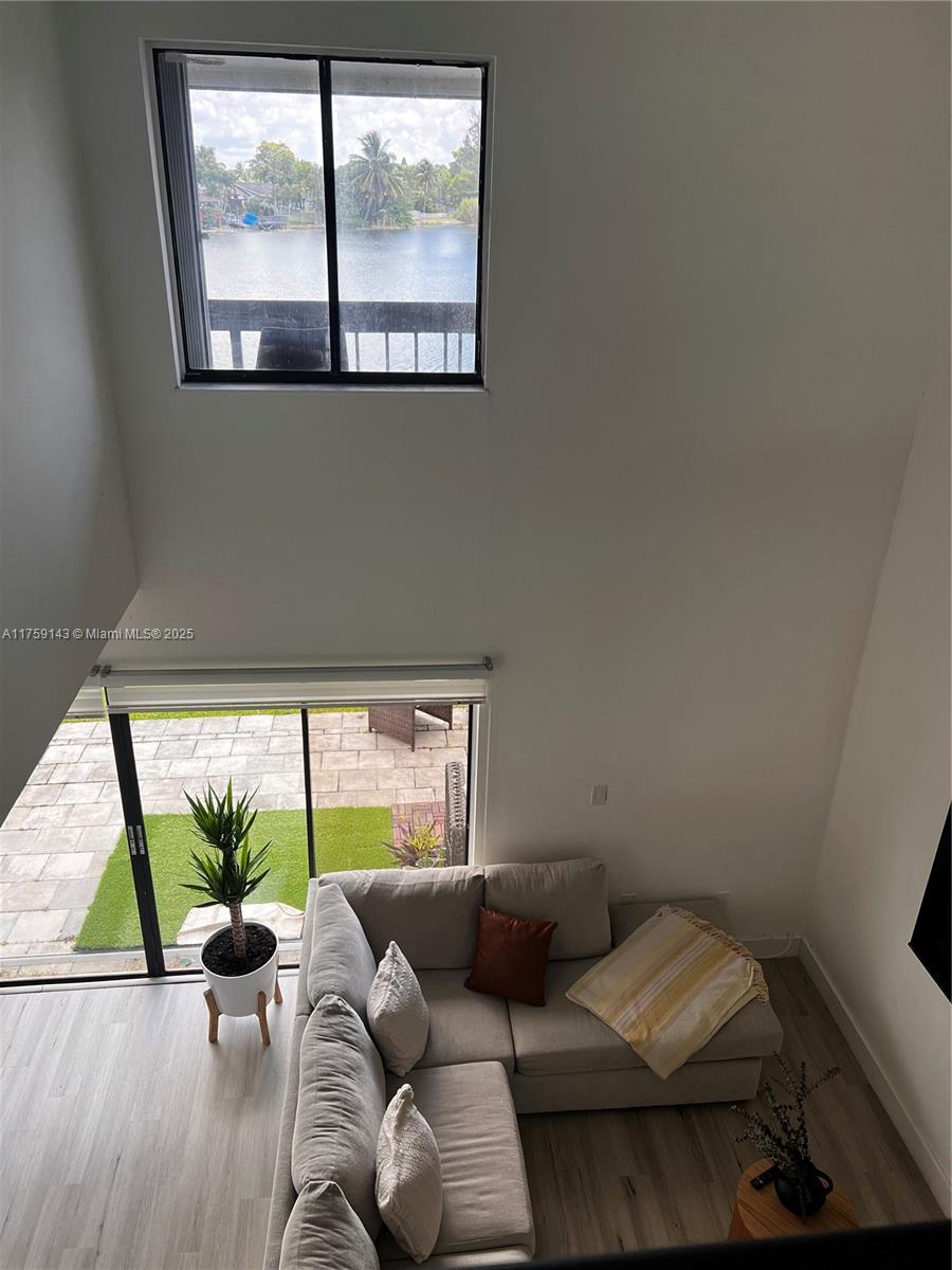 1351 Southwest 124th Court, Unit B5 Miami, FL 33184 - Photo 24 of 37 a living room with furniture and a large window