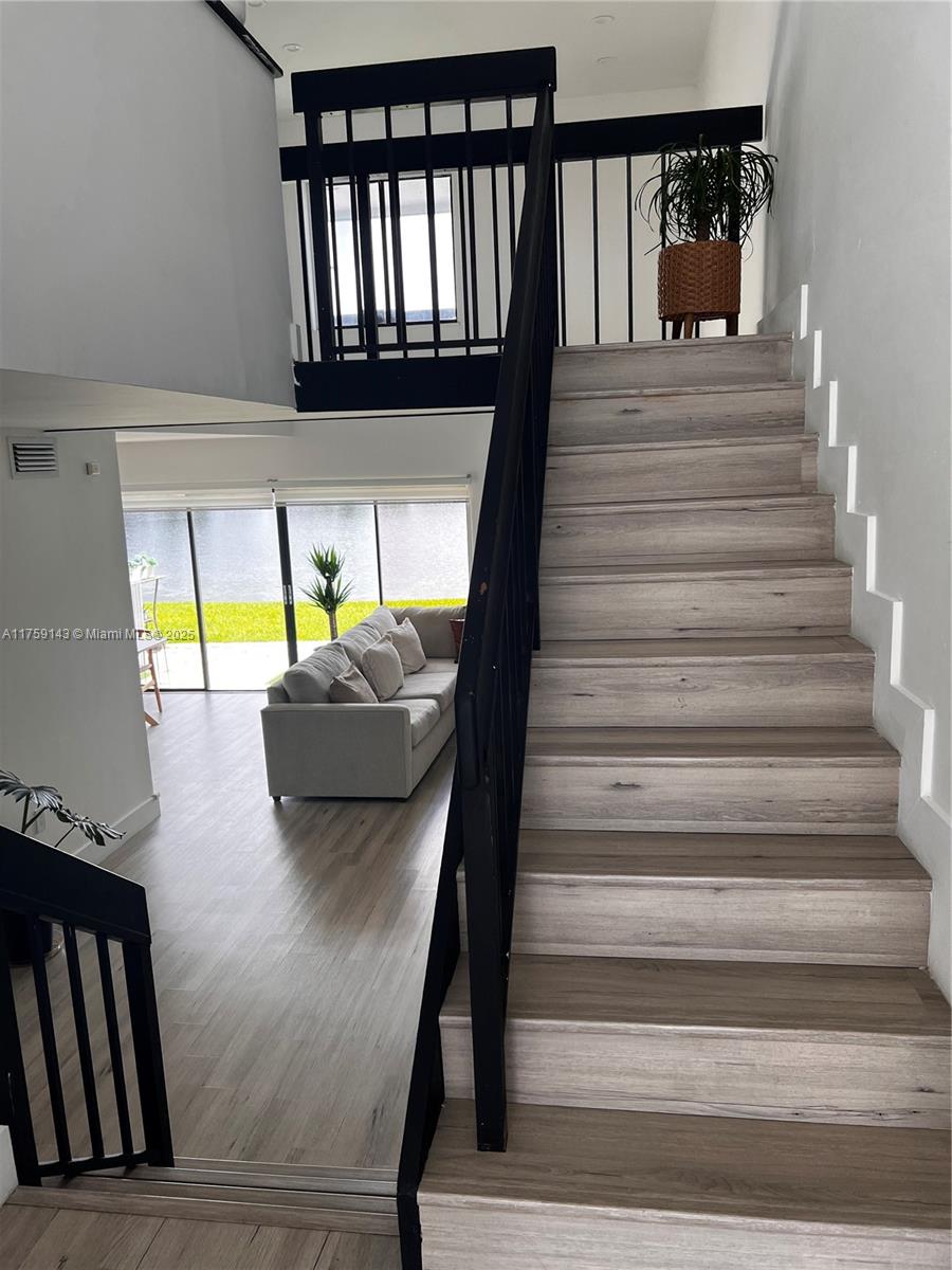 1351 Southwest 124th Court, Unit B5 Miami, FL 33184 - Photo 3 of 37 a view of entryway and hall with wooden floor