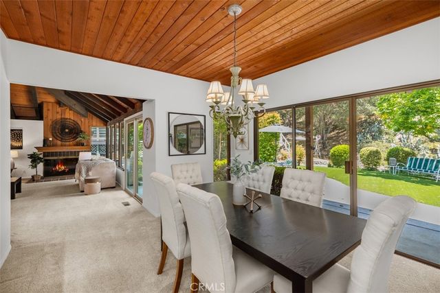 a bathroom with a granite countertop sink and a mirror with toilet