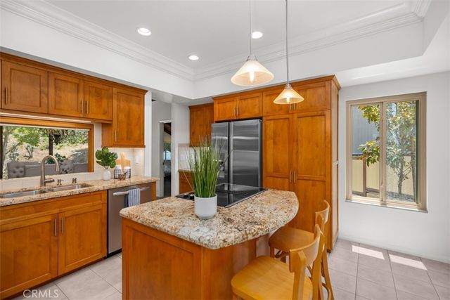 a bathroom with a granite countertop sink a toilet a mirror and shower