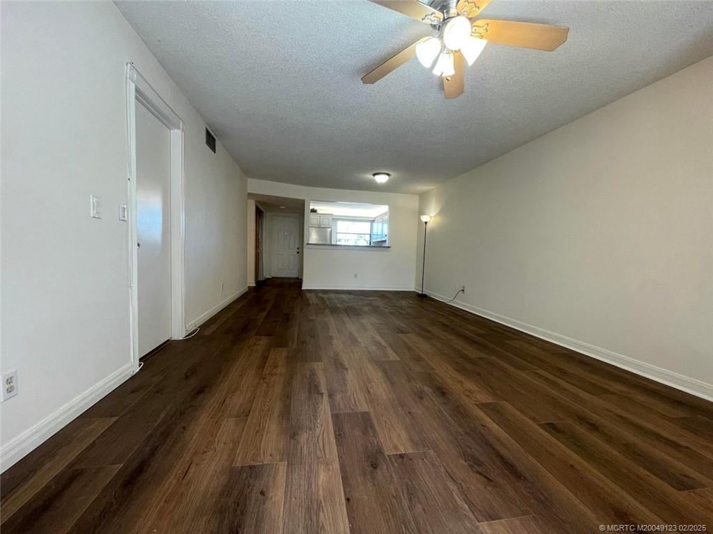 1270 Southeast Parkview Place, Unit B3 Stuart, FL 34994 - Photo 14 of 40 wooden floor in an empty room with a window